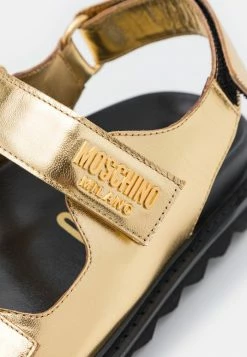 MOSCHINO Sandals - Oro -MOSCHINO SHOP 4d2cd4d7f367410faf0d2588d09072b4