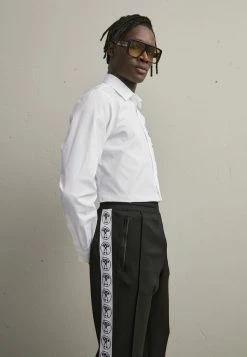 MOSCHINO TROUSERS - Tracksuit Bottoms - Fantasy Black -MOSCHINO SHOP 7040c9a94b74467e809831145e23949b