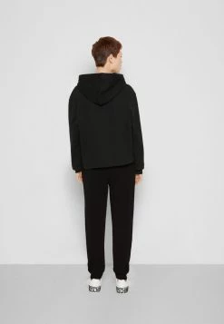 MOSCHINO CRYSTAL TEDDY BEAR - Tracksuit Bottoms - Black -MOSCHINO SHOP 70fb5437b8c34e14922e3fc478300ae5