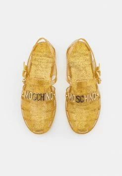 MOSCHINO Sandals - Oro -MOSCHINO SHOP 8c67d698d54140238f8f9b520840ba89