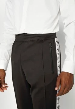 MOSCHINO TROUSERS - Tracksuit Bottoms - Fantasy Black -MOSCHINO SHOP c5a7a3c7083b4e218b04f04175078e5a