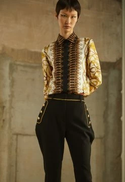 MOSCHINO TEDDY BEAR BUTTONS - Trousers - Black -MOSCHINO SHOP cc7ee58b88f6436982ad74b23008eae2