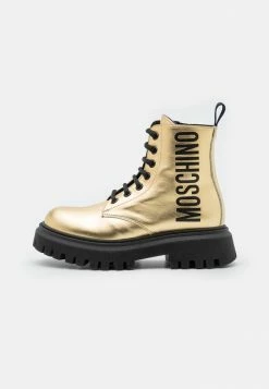 MOSCHINO COMBAT BOOTS MAXI LOGO PRINT - Lace-up Ankle Boots - Gold